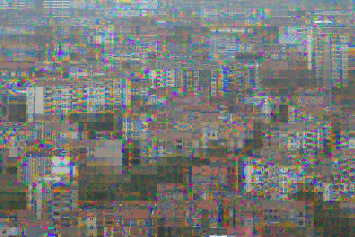 City blocks with repeating colour interference, photographed with Bayer Drift on the EOS M