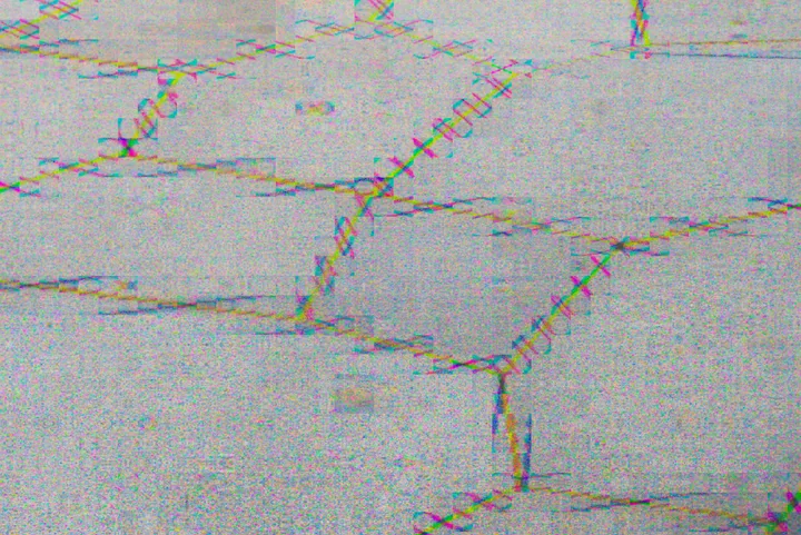 Brick wall with fine repeating colour patterns around the mortar, photographed with Bayer Drift