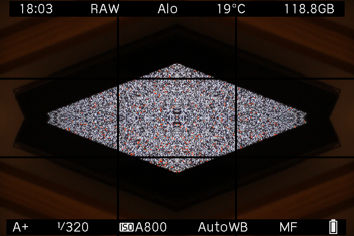 A television screen reflected into a rectangular kaleidoscope frame in EOS M LiveView