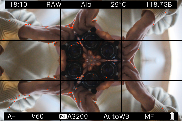 Photographer and Canon lenses repeated around the kaleidoscope center in EOS M LiveView