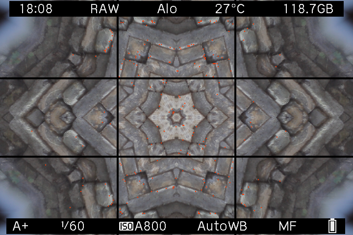 Stonework reflected into a kaleidoscope pattern on the original Canon EOS M LiveView screen